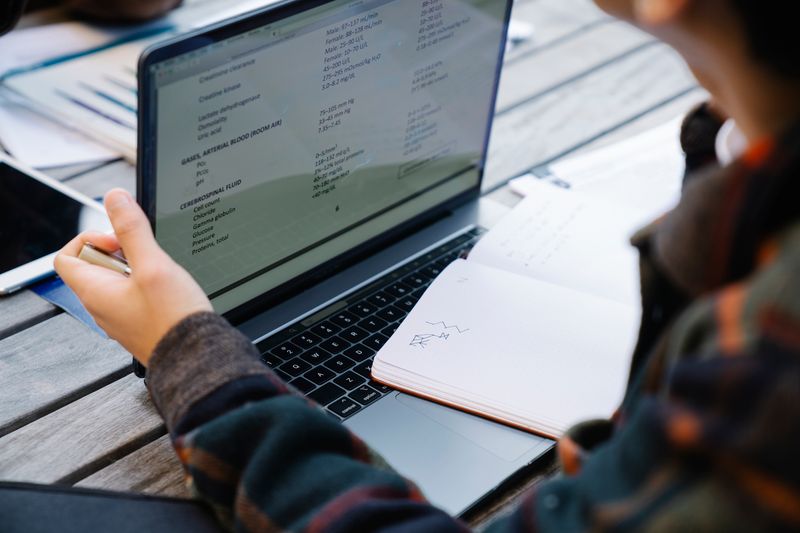 High school student working on a research competition project and analyzing data