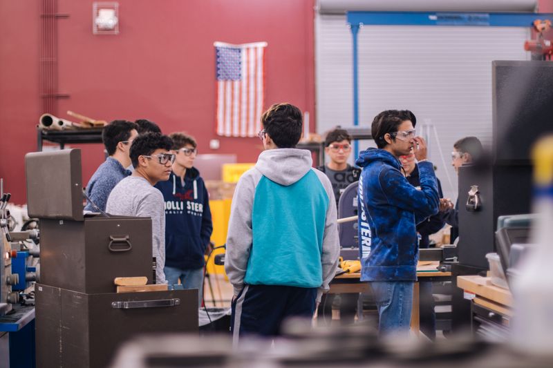 Students in a high school engineering shop working on biomedical engineering projects