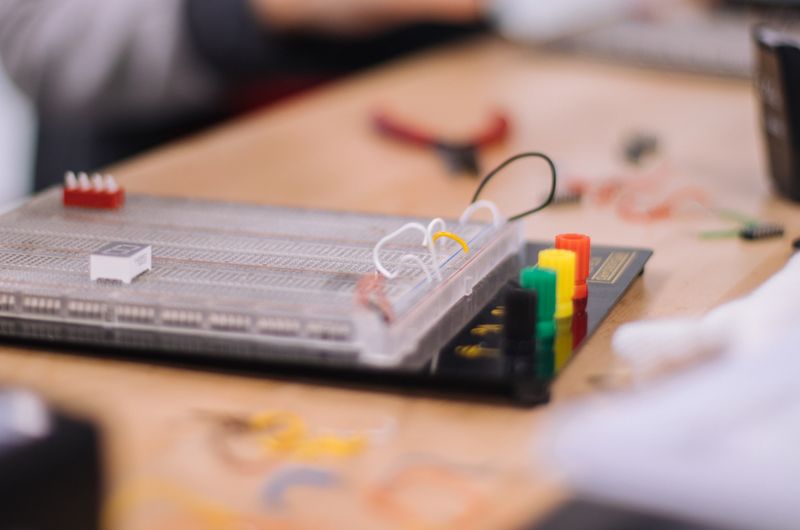 Breadboard with wires representing circuit design basics for beginners