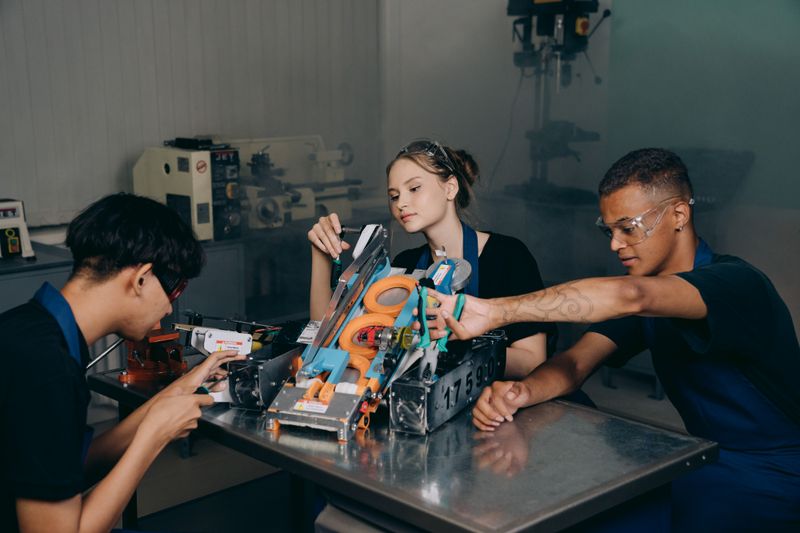 Students working together in a lab setting on a circuit design program