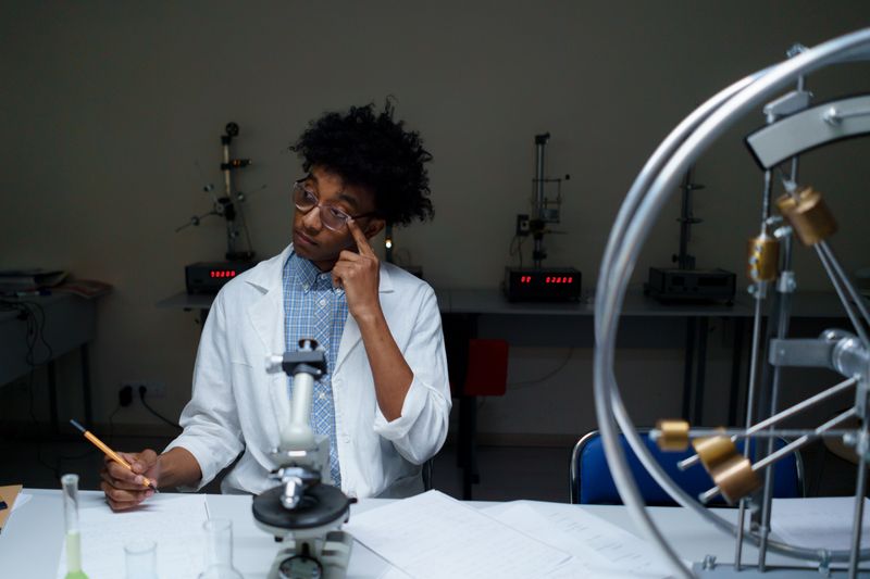 Student in a science lab representing the competitive cosmos summer program acceptance rate