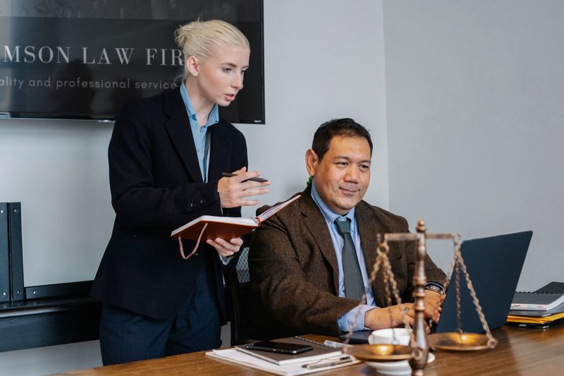 Young student taking notes in an office during a Dallas law internship for high school students