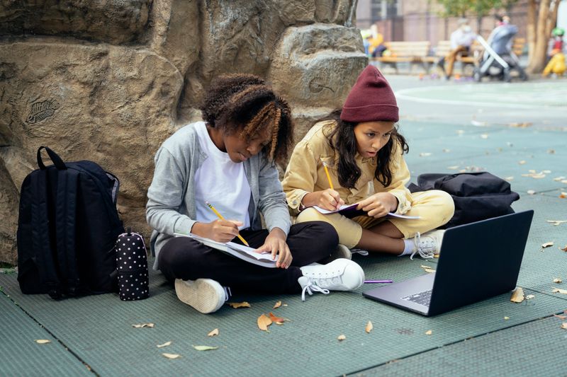 Students working on a venture concept outdoors for their Diamond Challenge submission