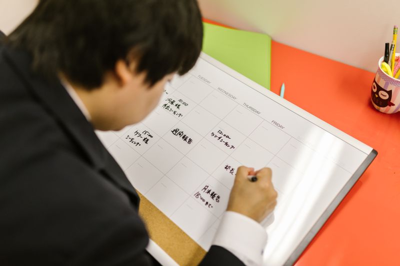 Student reviewing a checklist for free college application week deadlines