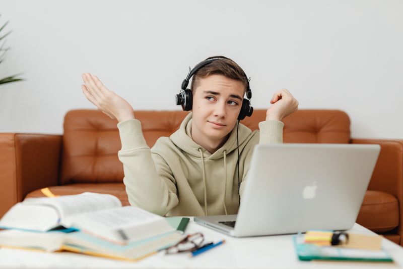 Student with headphones studying for a free government-funded language program