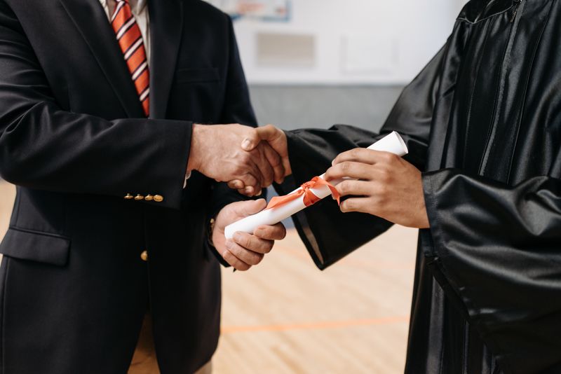 High school student celebrating academic achievement at a research competition