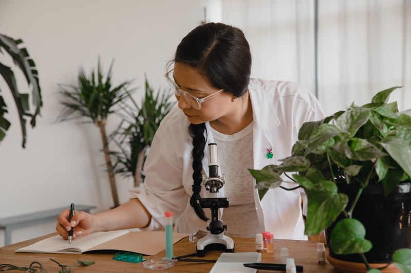 High school student conducting a science experiment for a research data collection phase