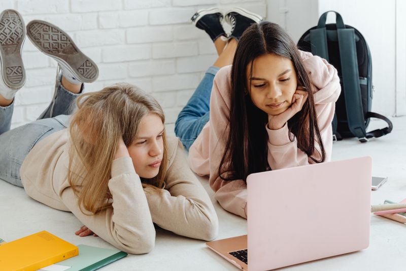 Two students looking at a laptop preparing a NASA SEES application