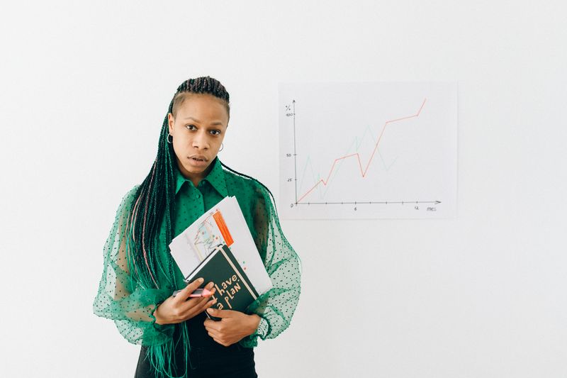 Student presenting a self-made graph that still requires citation on an ISEF poster