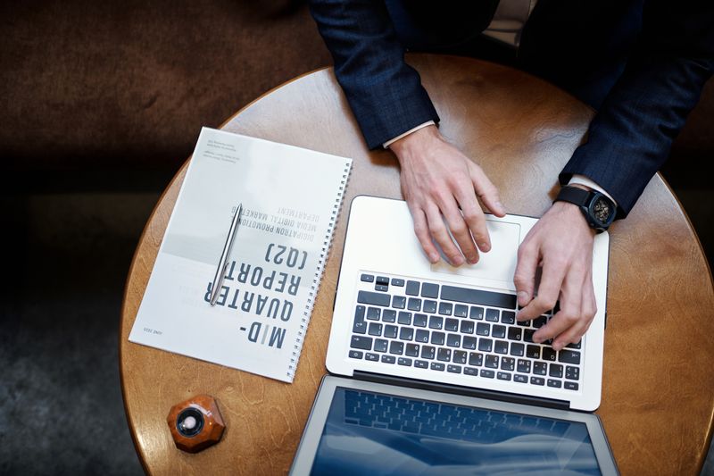 Student checking ISEF abstract format and word count on a laptop