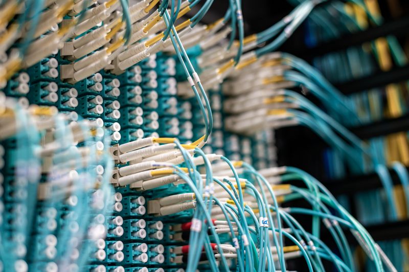 Network patch panel cables representing IT certifications for high school students