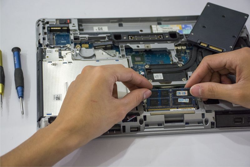 Hands installing hardware components as part of an IT internship, different from a coding internship