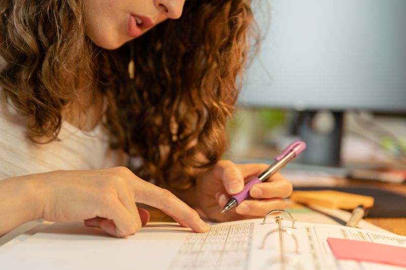 Researcher reviewing notes and limitations of a research paper