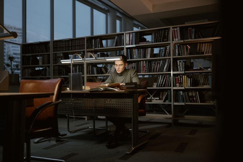 Research paper topics for high school students being explored through library books