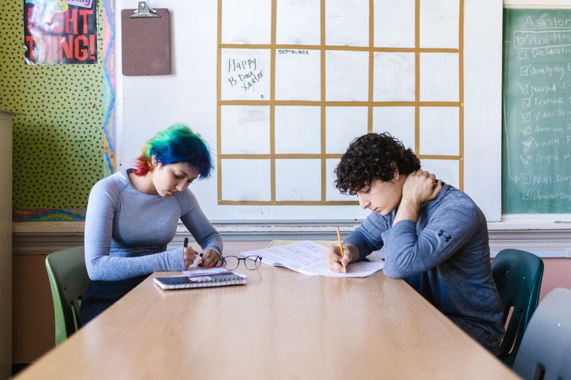 Research programs for high school students studying together at a table
