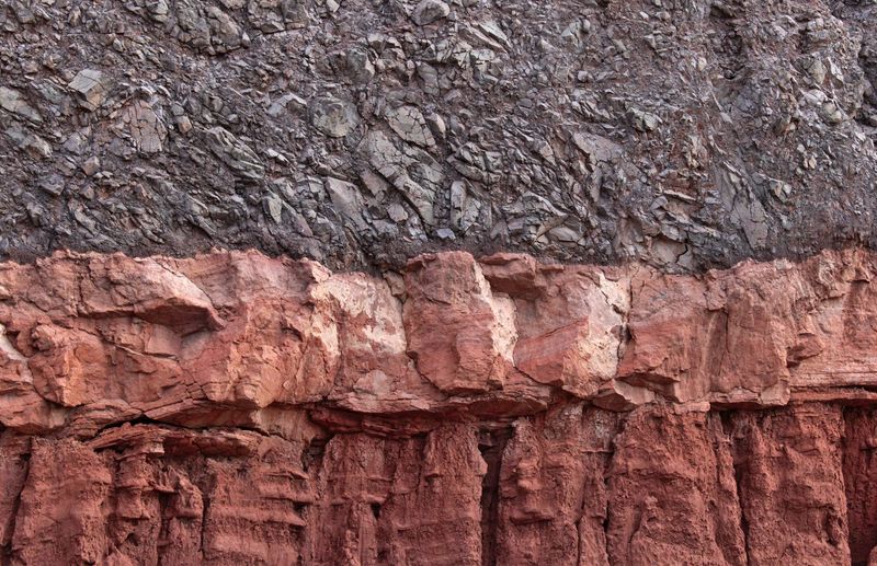 Stratified sedimentary rock layers studied for rock identification in Science Olympiad