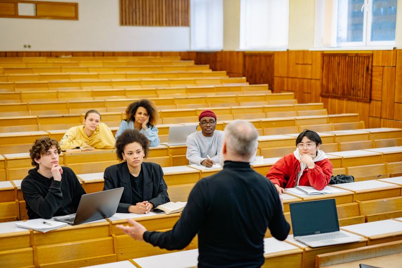 Crowded university lecture hall reflecting rising applicant pools at selective colleges