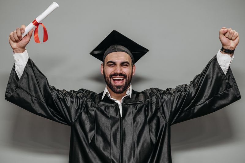 High school student celebrating completing an online research program project