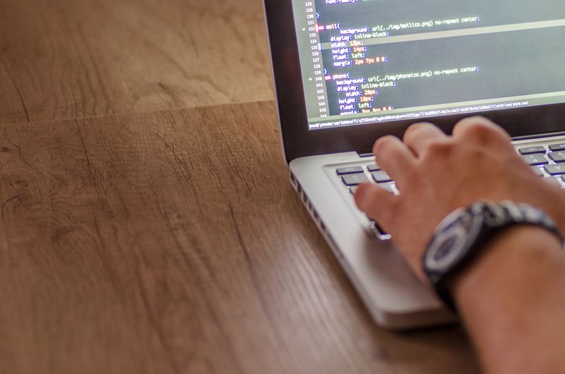 Student coding for a tech internship in high school