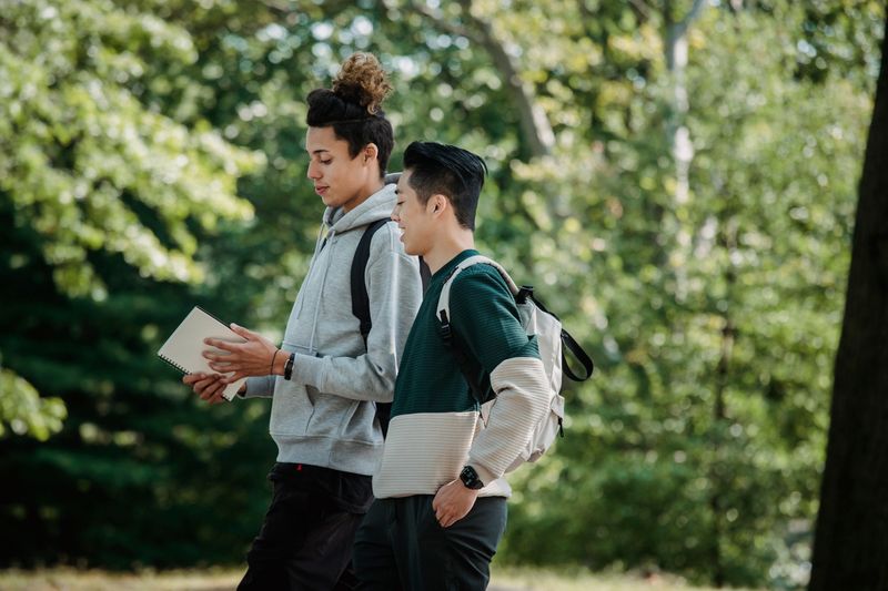 Students walking on a university campus for an engineering academy