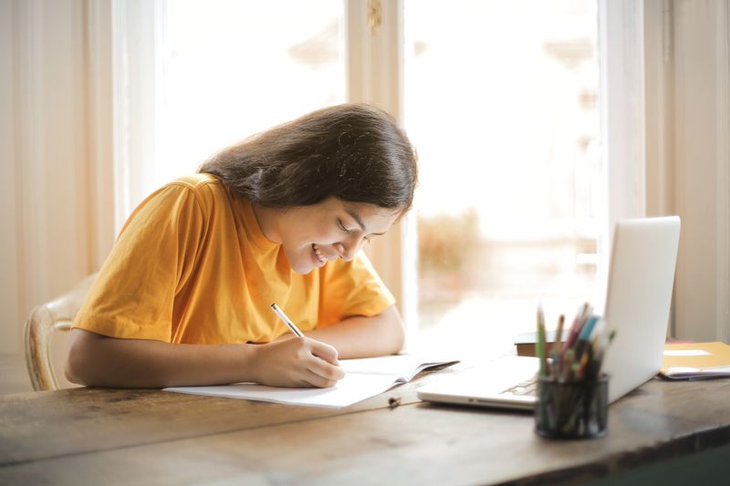 Student reviewing application materials for selective colleges