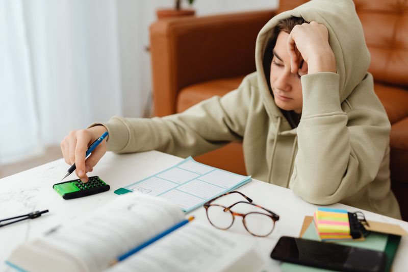 Student weighing options while deciding between IB and AP coursework