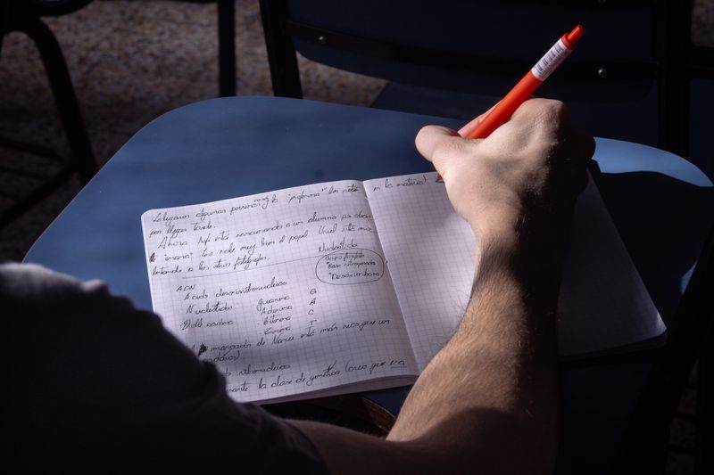 Student writing careful step-by-step instructions for the Write It Do It event